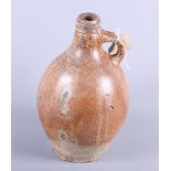 An 18th century stoneware flagon, 10 1/2" high, and a studio pottery shaped vase, 8 1/2" high