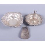 A set of four Victorian circular silver salts and spoons, a silver heart-shaped bonbon dish, a