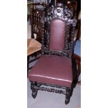 A 17th century design black stained standard chair, upholstered in a nailed brown leather
