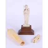 A carved ivory figure, Madonna and child, a carved ivory husk of corn and an Indian carved ivory