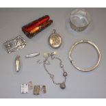 An engraved silver bangle, a Victorian white metal locket, a pair of silver cufflinks, a silver swan