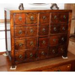 A 19th century Chinese hardwood medicine chest, fitted twenty drawers with ring handles, 30" wide