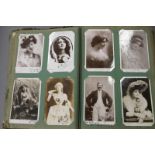An album of Edwardian photographic postcards, theatrical figures