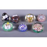Four modern millefiore decorated paperweights and three others