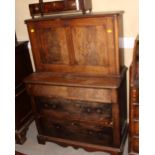 A 19th century Continental walnut two-stage desk with fall front, over base fitted three drawers,