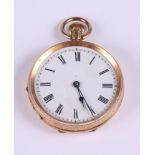 A 14ct gold cased lady's open faced fob watch with white enamel dial and Roman numerals