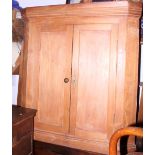 A 19th century pine wall hung corner cabinet with plain panelled door, 42" wide