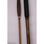 A Hardy Holdtight two-section cane fishing rod and a Hardy 12 foot Long Bow sea fishing rod