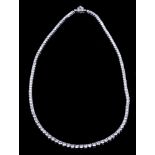 A platinum and diamond necklace set one hundred and thirty-one graduated brilliant cut stones,