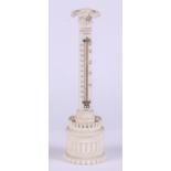 A desk thermometer, on carved ivory column