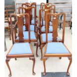 A set of seven Queen Anne design mahogany dining chairs with drop-in seats, upholstered in a blue