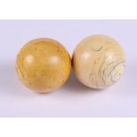 Two Victorian ivory billiard balls