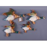 A set of four Beswick flying duck wall pockets (largest repaired)