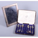 A cased set of six silver teaspoons, 3.6oz troy approx, together with a rectangular silver