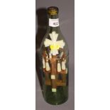 A pilgrim's 19th century Holy Land bone and cypress cross in a bottle souvenir, 11 3/4" high