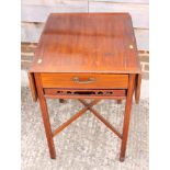 A crossbanded mahogany breakfast table, fitted shallow end drawer and sliding tray, on square