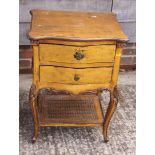 A giltwood bedside table, fitted two drawers with a cane undertier