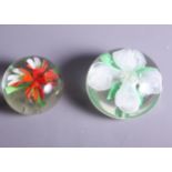 Two large Baccarat style floral decorated paperweights