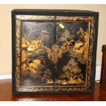 A 19th century Chinese lacquered table cabinet, fitted ten drawers and removable tray, enclosed