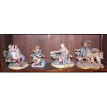 A collection of four Capodimonte figures, on benches