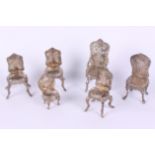 Six Continental silver miniature dolls house chairs with embossed decoration