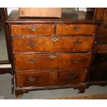 An early 18th century walnut chest of two short and three long drawers, on bracket supports, 38"