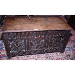An 18th century oak coffer, three panel front carved roundels, 31" wide
