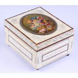 A tortoiseshell and ivory trinket box, the lid inset with miniature still life of flowers
