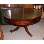 A 19th century circular mahogany library table with inlet green tooled leather top, real and dummy