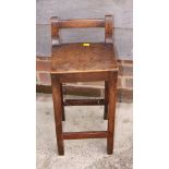 A child's 19th century high chair with low bar back and a child's Victorian balloon back chair