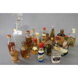 Eighteen miniature bottles of whisky and liqueurs and a 19th century glass decanter and stopper
