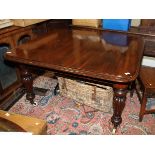 A William IV mahogany extending table, on turned and reeded supports, 52" x 48", opening to 78" when