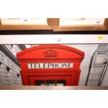 A photographic print of a red telephone box and Queen Elizabeth Tower, 43" x 31", in black frame