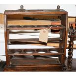 A wooden two-tier spice jar holder with hinged shelves, 14" wide, and a wooden egg stand