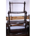 A grained as rosewood four-tier wall shelf, 18" wide