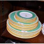A set of seventeen Minton dinner plates with green speckled borders, in three sizes