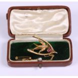 A 15ct gold, ruby and seed pearl wishbone brooch, 3.5g