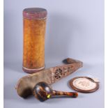 A maraca, an oud (damages) and an Oriental pillow