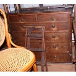 A 19th century oak chest of two short and four long drawers with ring handles and quadrant