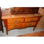A Victorian walnut chest of two short and one long drawer, on turned supports, 48" wide