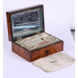 A 19th century burr walnut sewing box with part fitted ivory and gilt metal mounted interior
