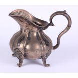 A Russian silver cream jug with scrolled handle, 7.7oz troy approx