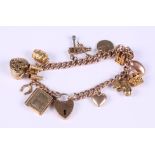 A 9ct gold curb link bracelet with heart-shaped clasp and thirteen charms, various, 40.1g gross