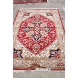 A Heriz design silky pile rug on a beige ground, 110" x 79" approx