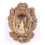 A pair of Continental carved bone figured scenes, in gilt frames, 5 1/2" high, and a plaster