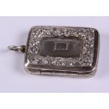 A Georgian silver vinaigrette with engine turned and embossed decoration, pierced grill and gilt