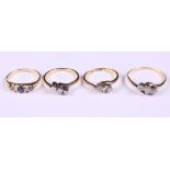 Three 18ct gold and diamond three stone crossover rings, various, 6.6g, together with a gold,