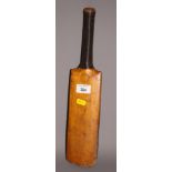 A miniature cricket bat stamped CT & Co, 16" long and a page containing the signatures of the