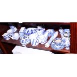 A Willow pattern beer pump handle, a blue and white stoneware mug and other assorted blue and