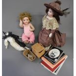 A modern doll and assorted doll parts, etc